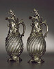 A beautiful pair of Rococo revival silver mounted claret jugs
